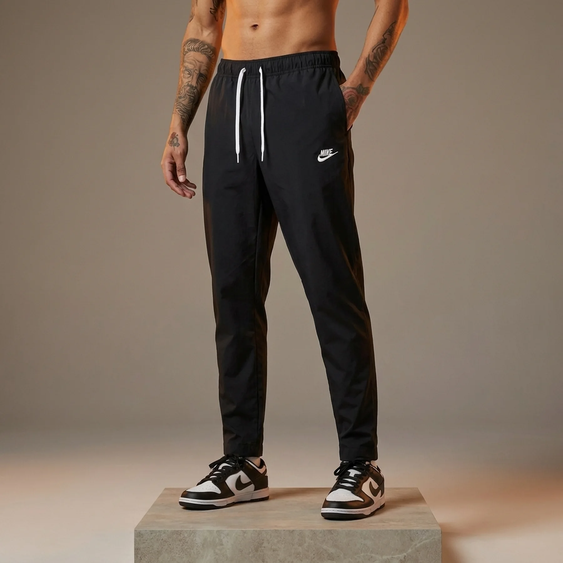 Брюки чоловічі Nike Club Wvn Taper Leg Pant (DX0623-010)