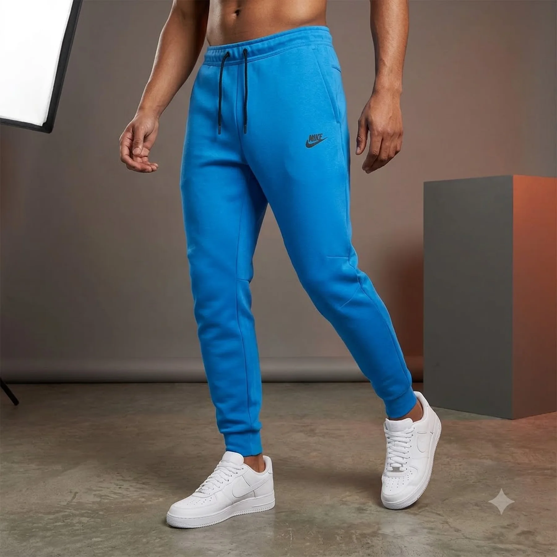 Брюки чоловічі Nike M Tch Flc Jggr (FB8002-435)