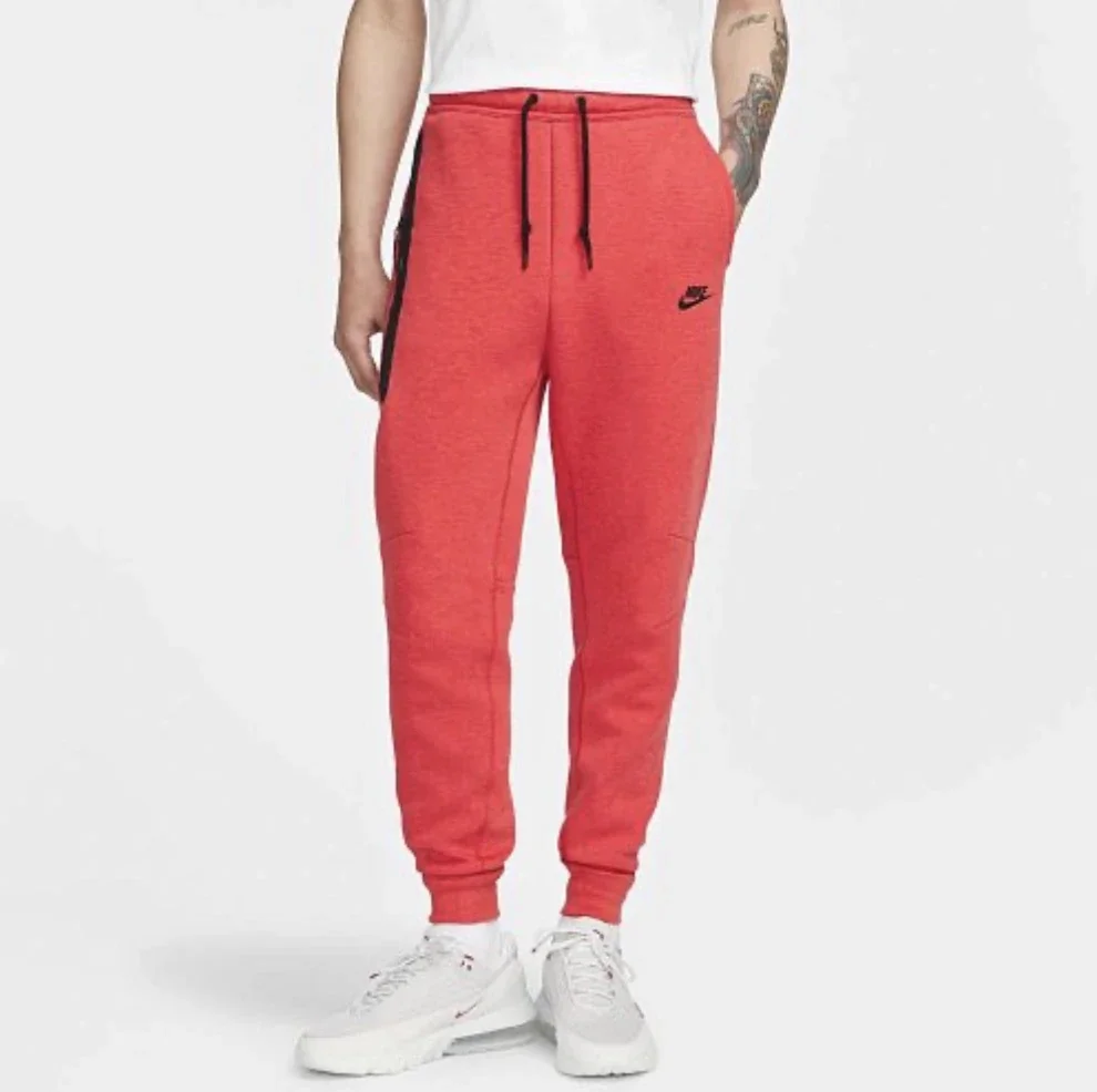 Брюки чоловічі Nike Tch Flc Jggr (FB8002-672) — Одяг