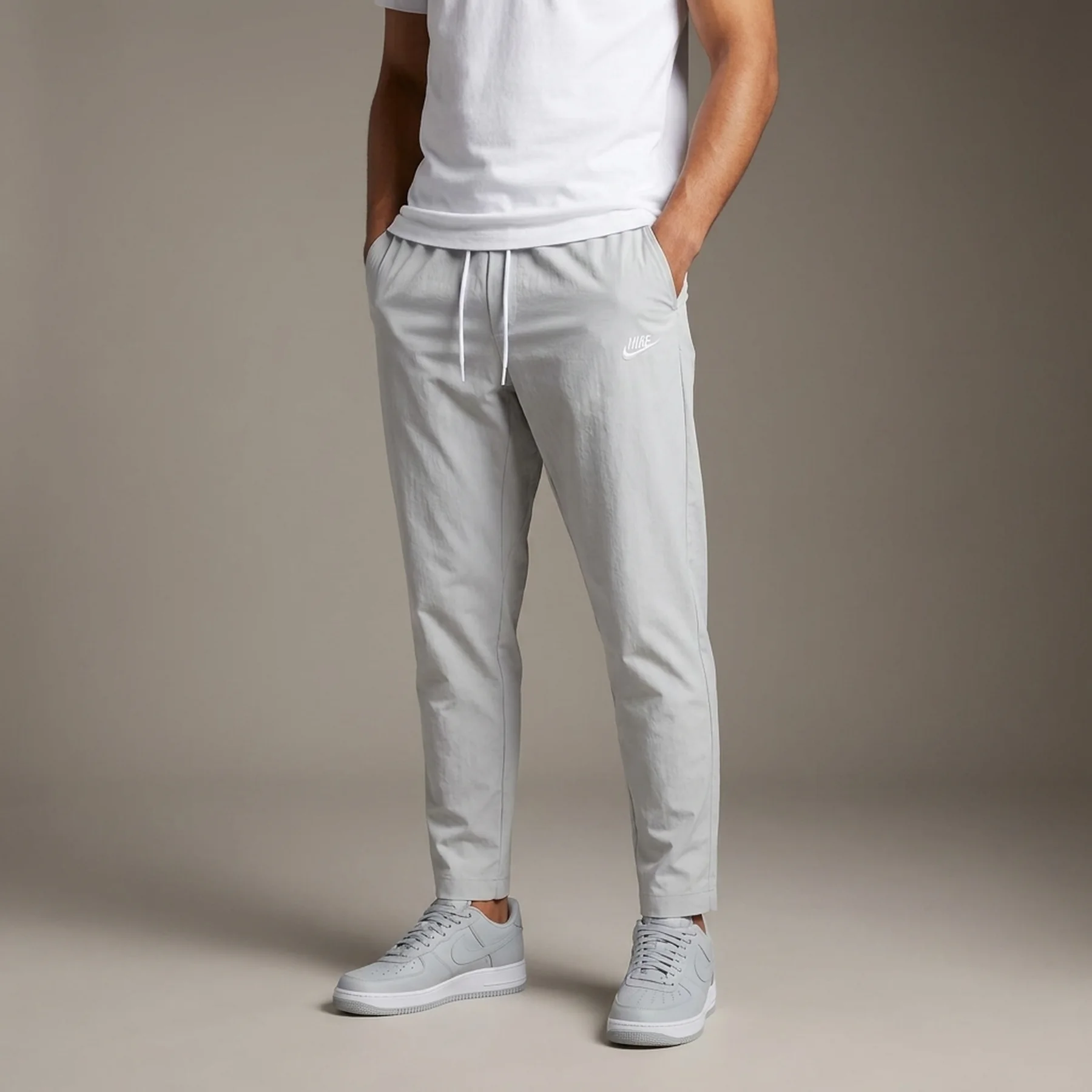 Брюки чоловічі Nike Woven Tapered Leg Pants (DX0623-077)
