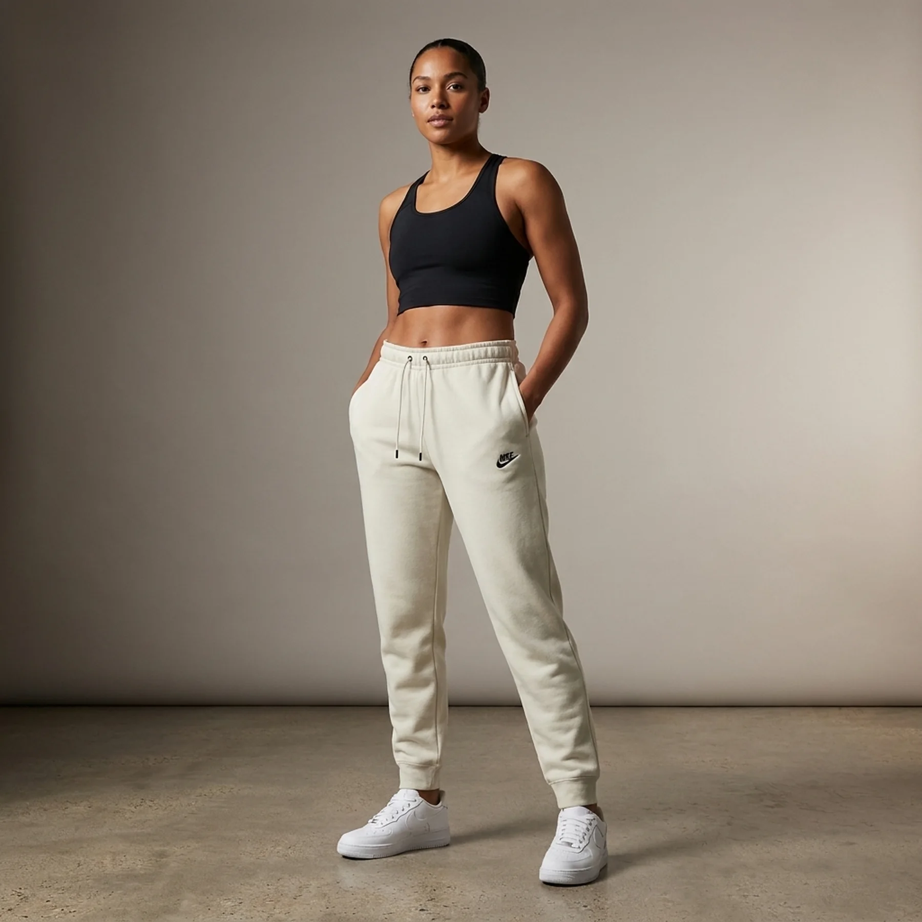 Брюки жіночі Nike Essntl Pant Reg Flc Mr (DX2320-104)