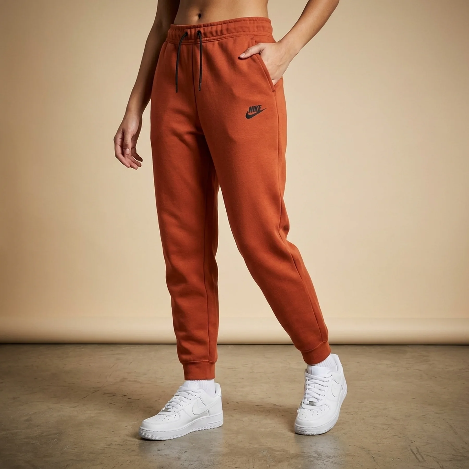 Брюки жіночі Nike W Nsw Tch Flc Mr Jggr Orange (FB8330-825)