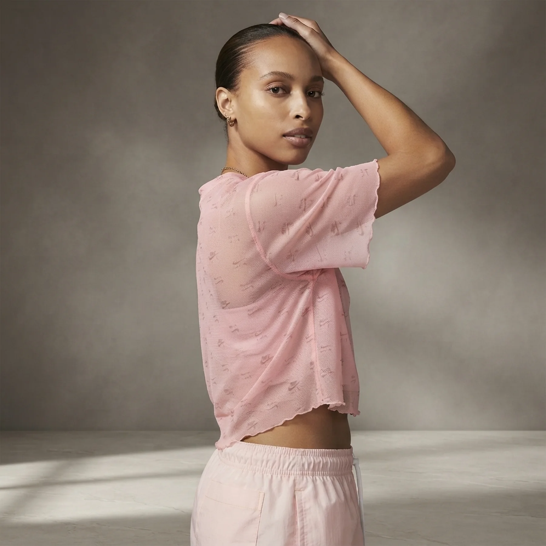 Футболка жіноча Nike Air Printed Mesh Short-Sleeve Crop Top (DV8245-611)