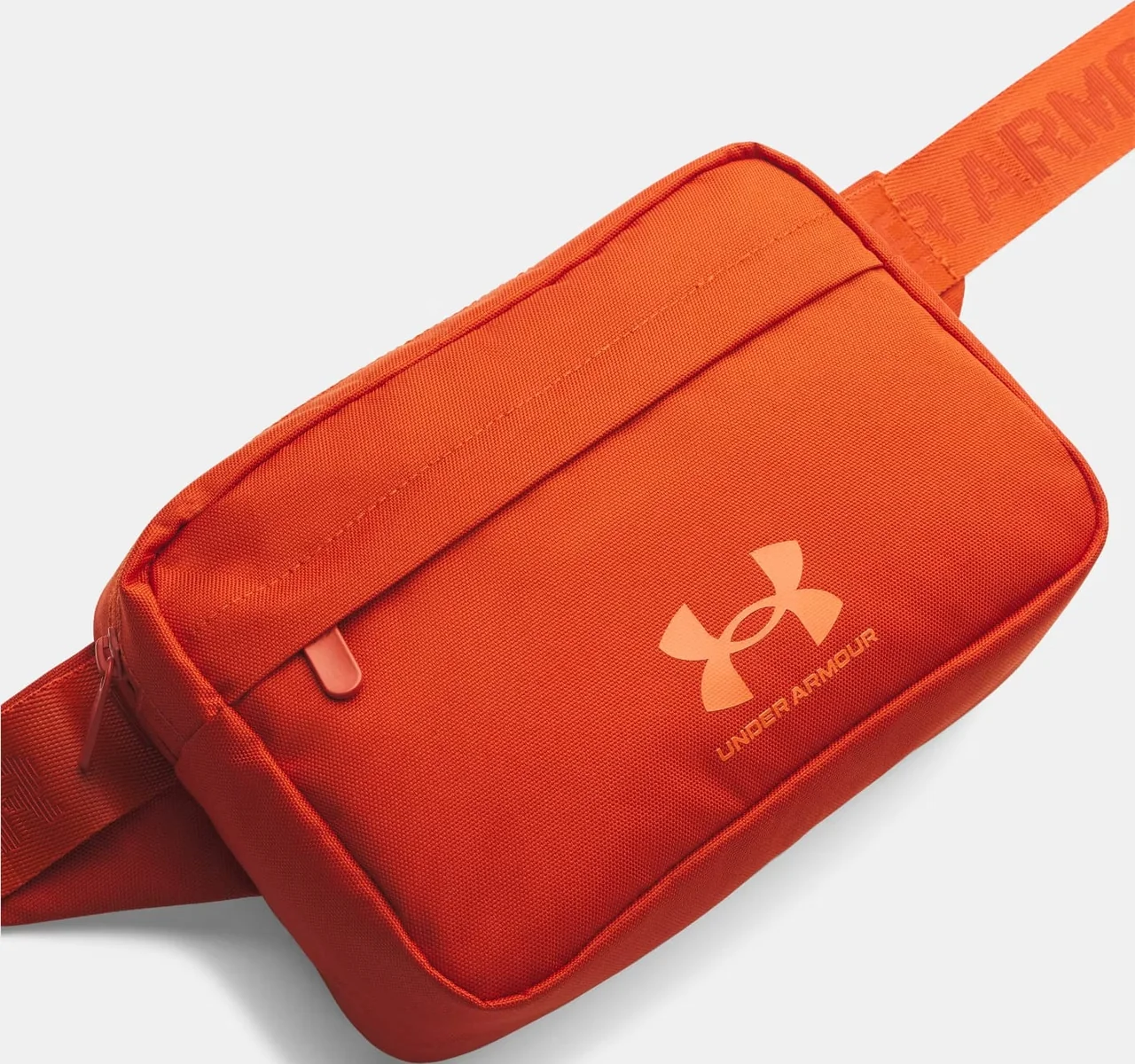 Сумка на пояс Under Armour Essential Lite WB Xbody 2L помаранчевий 15,3 x 24 x 10,5 см (1381914-842)