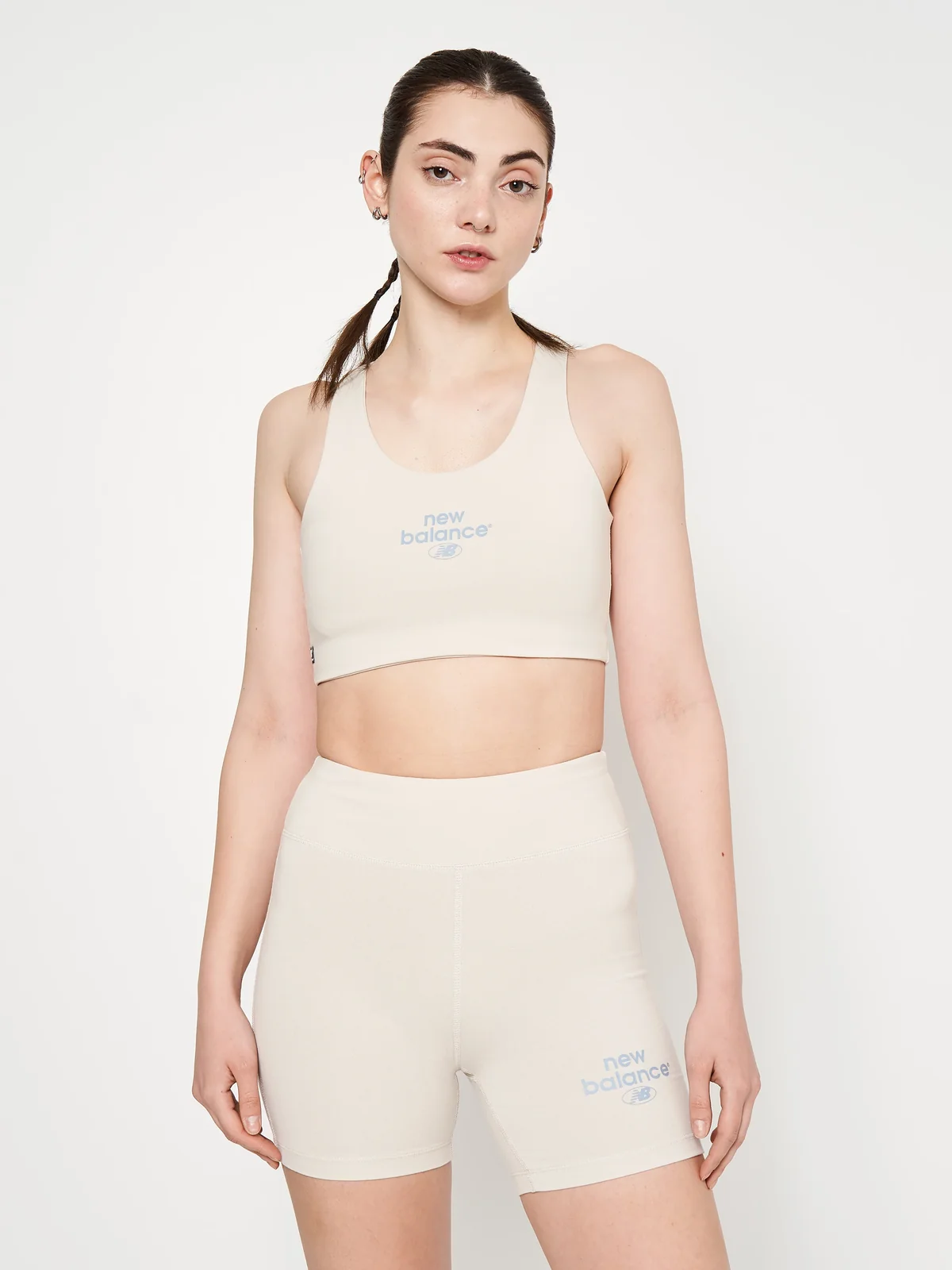Спортивний топ жіночий New Balance Essentials Reimagined Bra White (WB31500MBM)